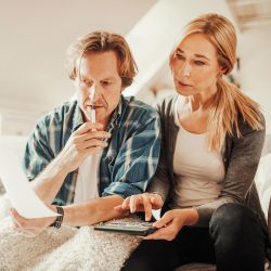 Photo of a mature couple calculating home finances